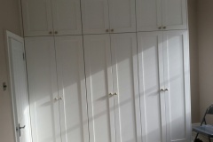 Completed build-in bespoke fully fitted bedroom wardrobe by Construction Bear